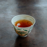 Dahongpao rock tea from Banyan premium area, Wuyi, Wuyishan, in China. Loose leaf wulong tea in antique Chinese cup