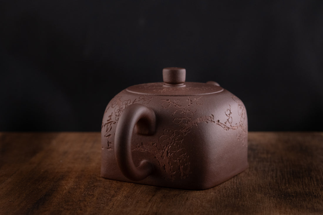 Tian Di Fang Yuan 天地方圆 - Flower carved Yixing teapot, Zini purple clay