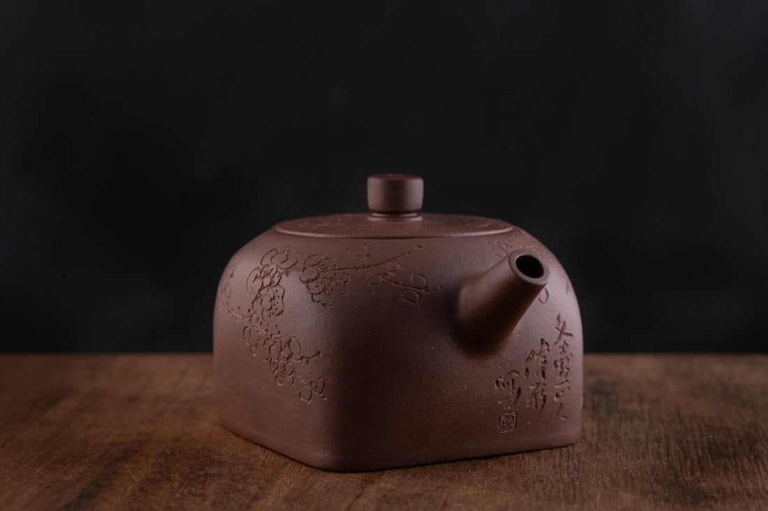 Tian Di Fang Yuan 天地方圆 - Flower carved Yixing teapot, Zini purple clay