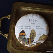 Pu'er shengpu from ancient trees gushu, laoyezi huangpian, in pressed cake from Lunan and Pasha mountain, Yunnan, China
