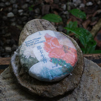 forest pu'er tea from Naka village, Yunnan, China, stone-pressed for collection, shengpu 