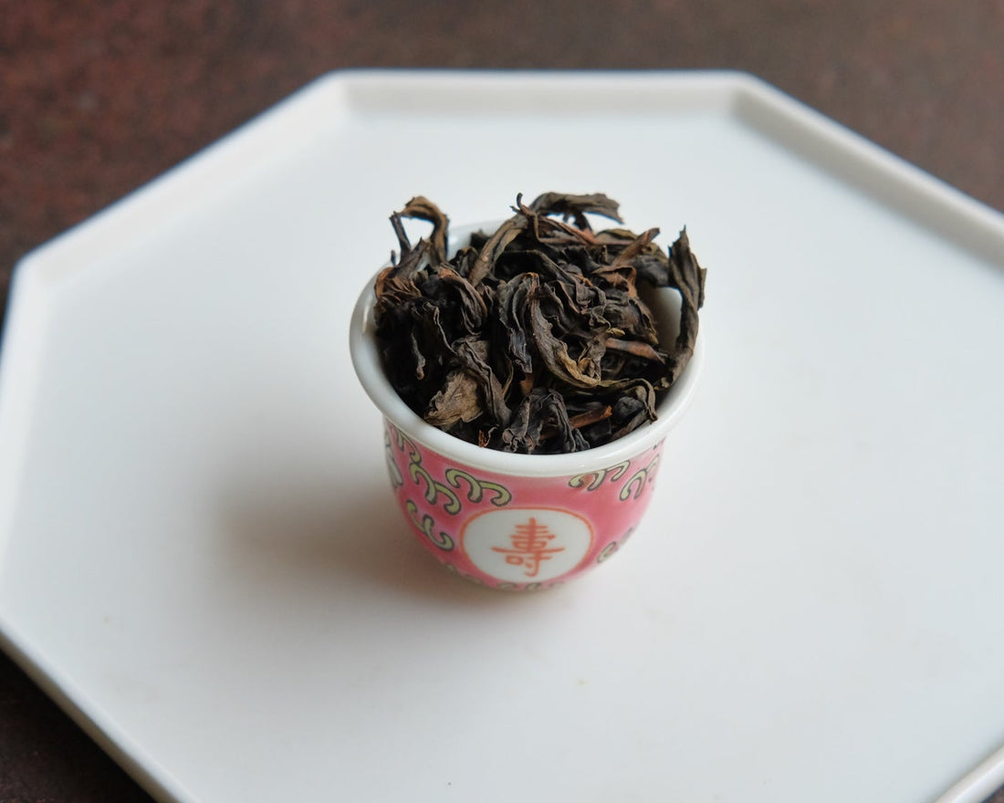 Dahongpao rock tea from Banyan premium area, Wuyi, Wuyishan, in China. Loose leaf wulong tea in antique Chinese cup